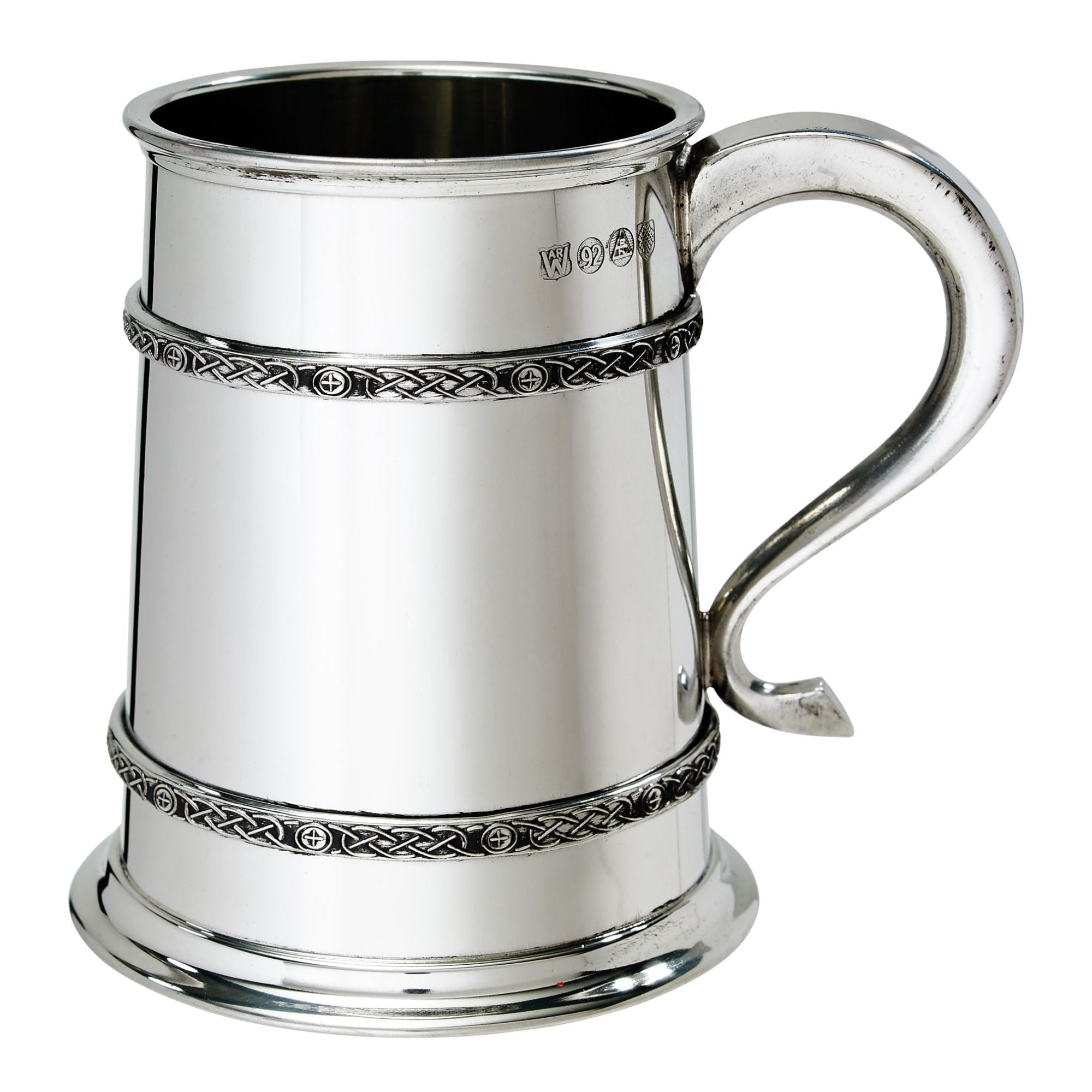 Silver tankard with Celtic knot designs on a white background