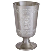 Silver goblet with intricate designs on a white background