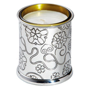 Decorative candle holder with floral patterns on a white background