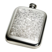 Silver flask with skull and heart pattern on a white background