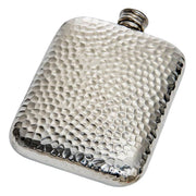 Silver hip flask with textured surface on a white background