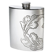 Silver hip flask with floral engraving on a white background