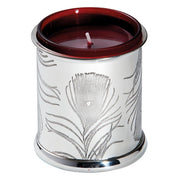 Silver candle holder with leaf patterns and a red candle on a white background