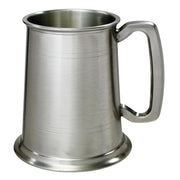 Stainless steel tankard with handle on a white background