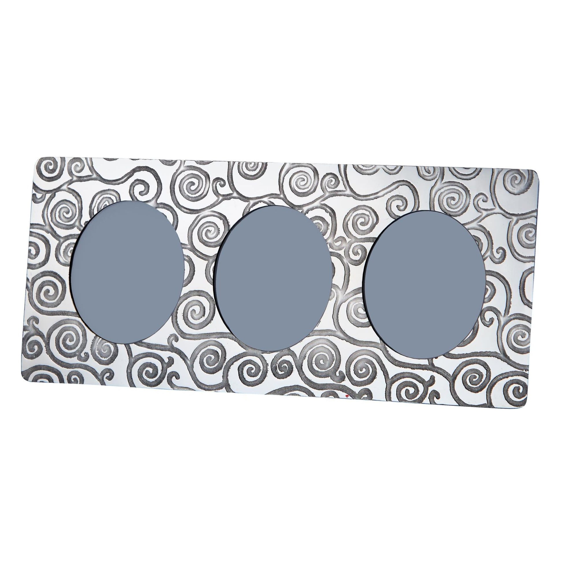Three gray circular objects on a patterned white background