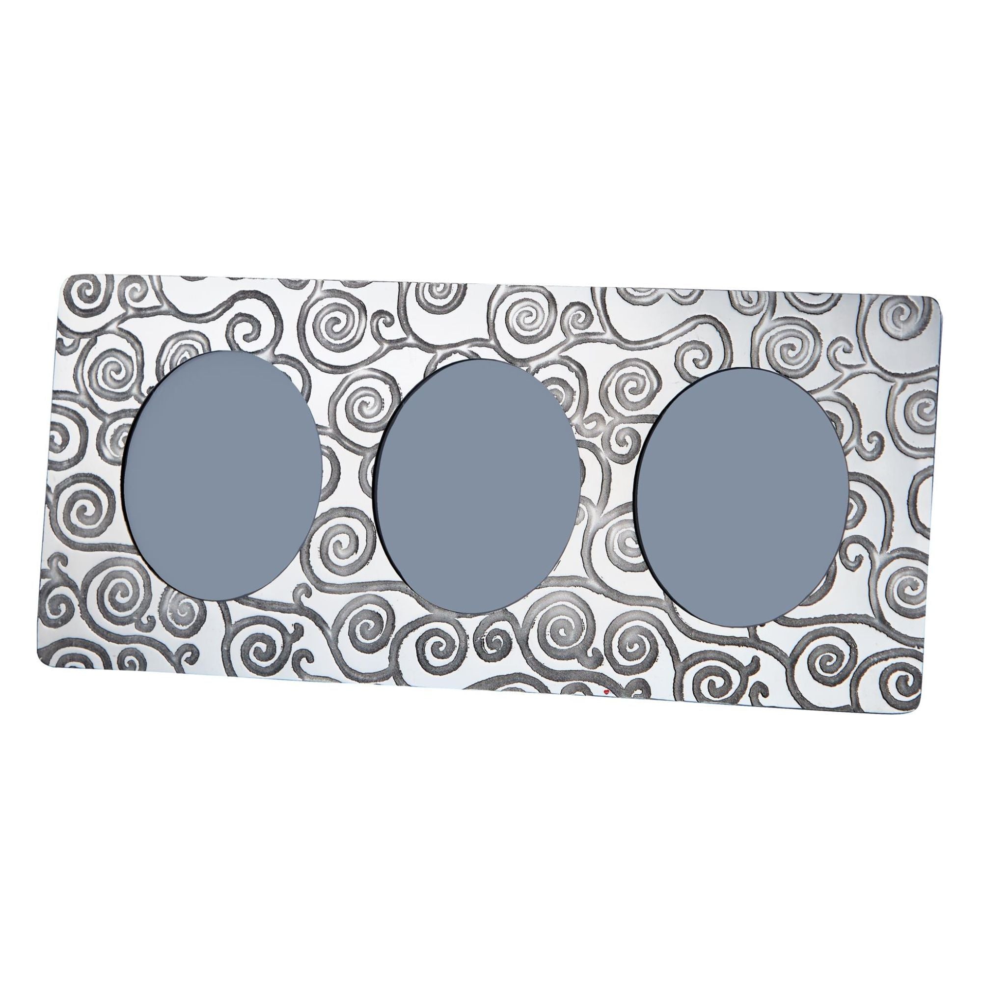 Three gray circular objects on a patterned white background