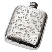 Silver hip flask with intricate Celtic knot design on a white background