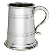 Silver tankard with a handle on a white background