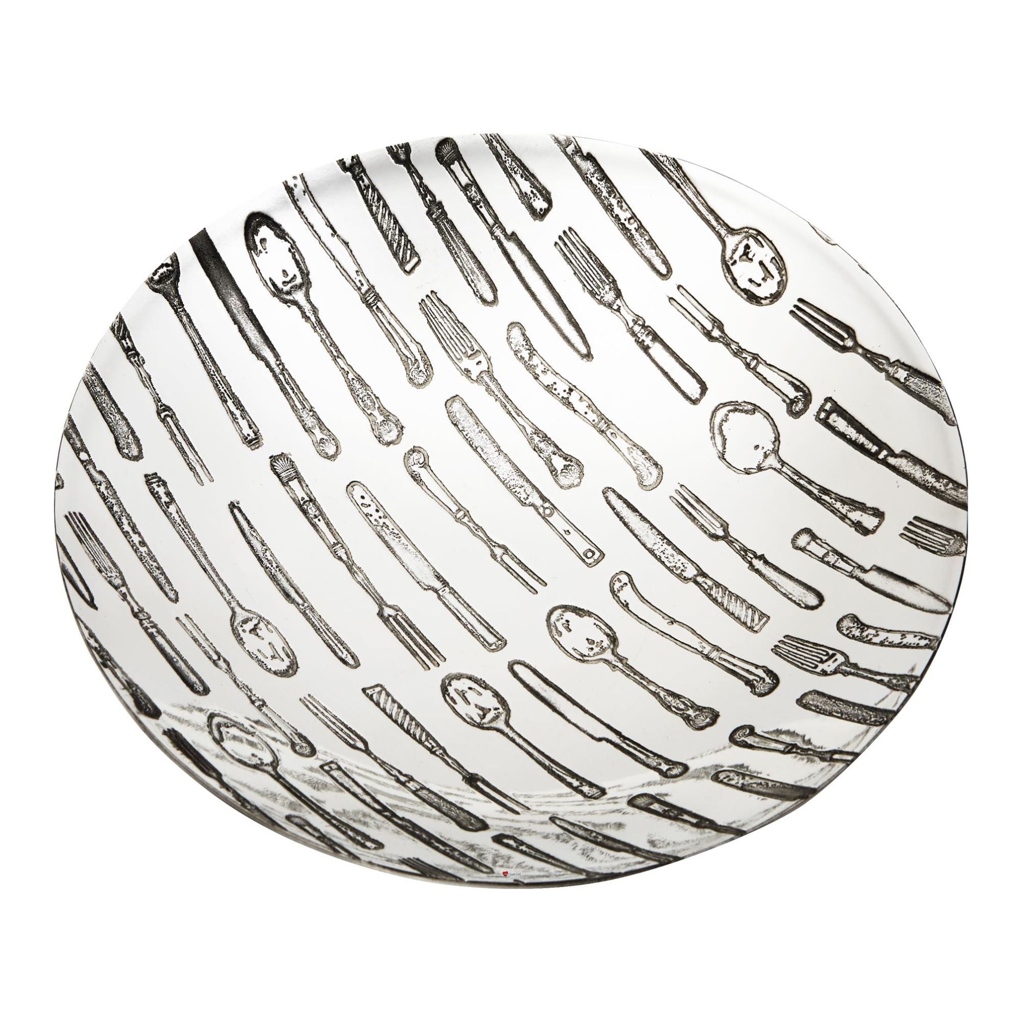 Round ceramic plate with black and white cutlery pattern on a white background