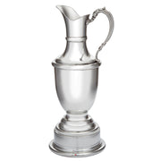 Silver pitcher on a white background