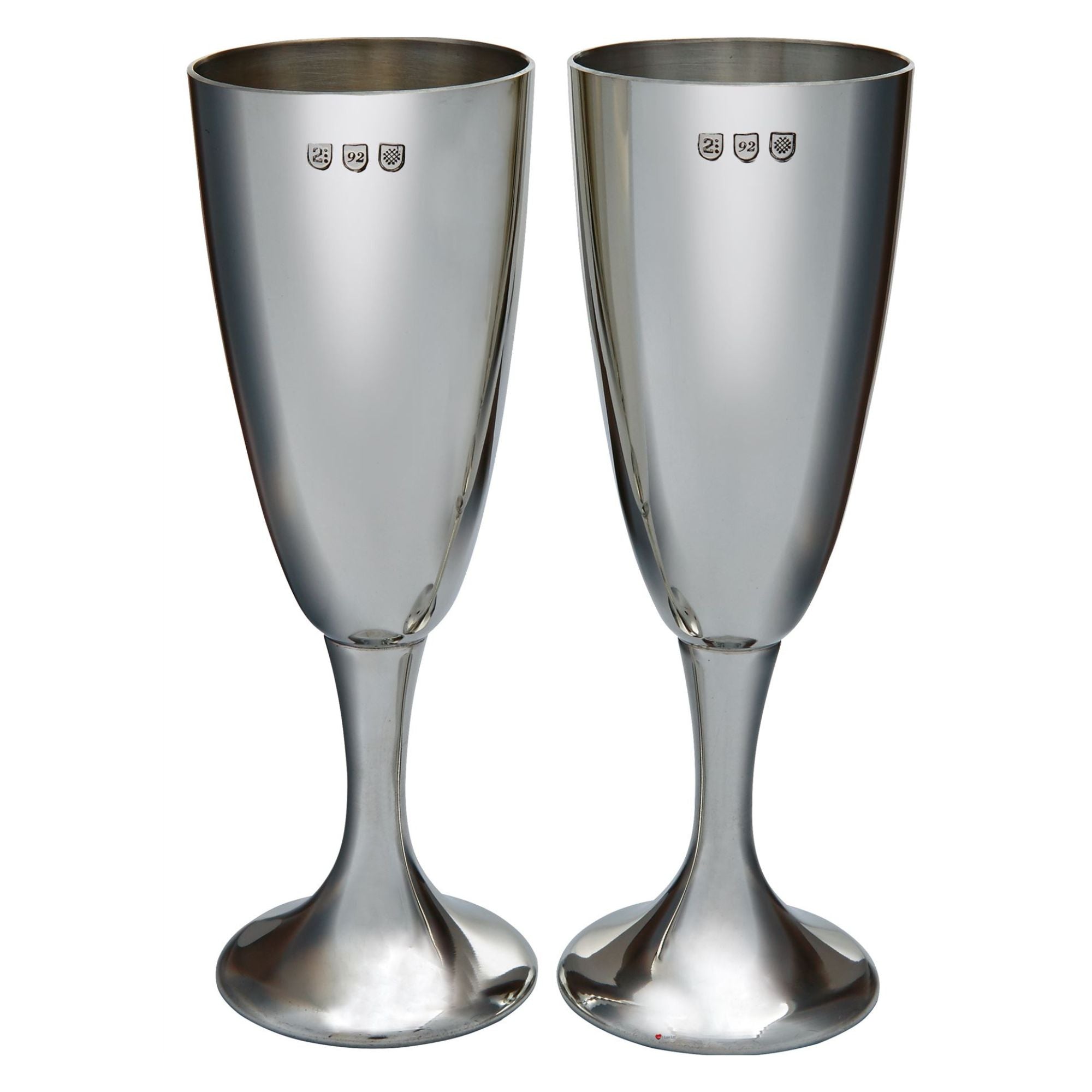 Two silver champagne flutes on a white background